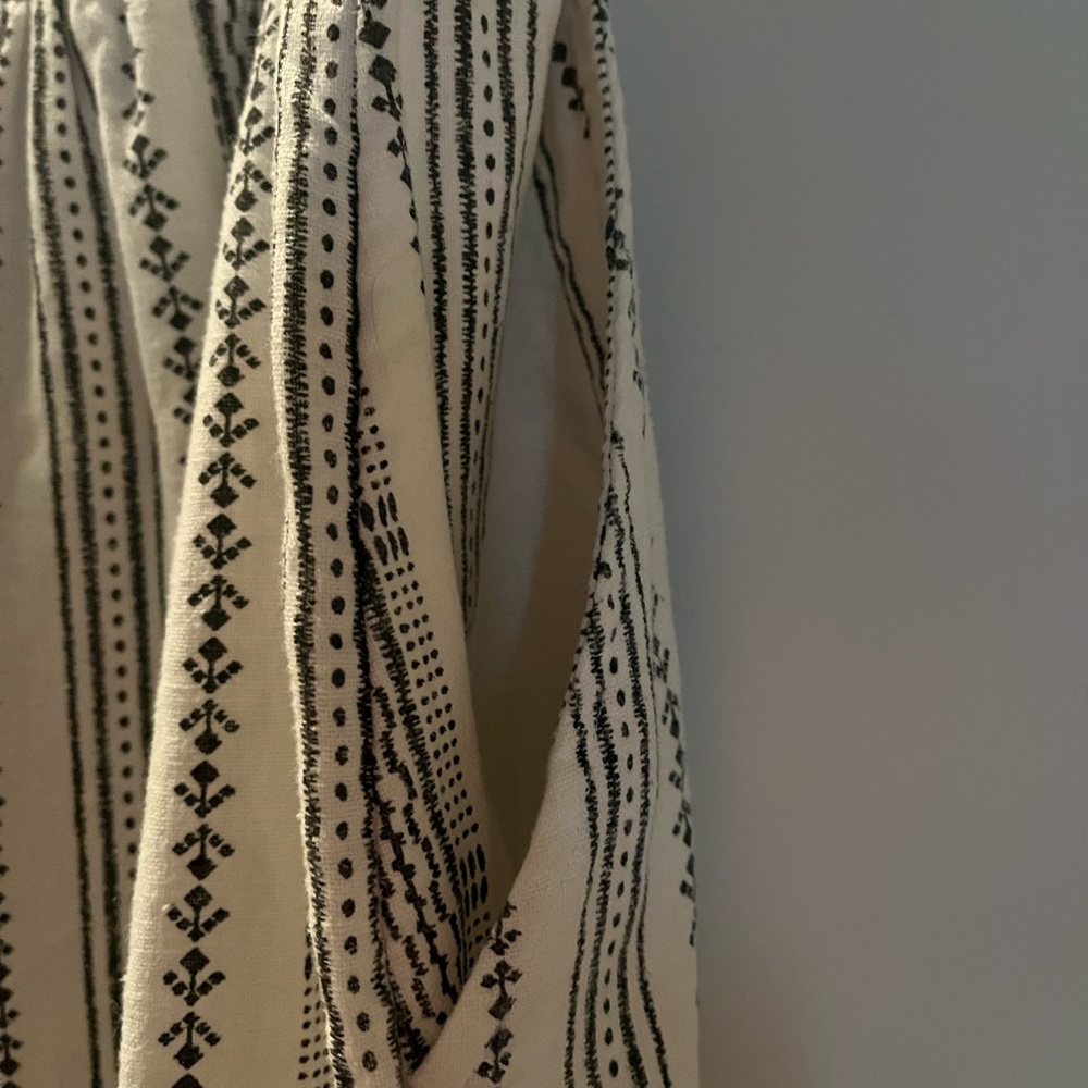 Wide leg white romper with dark gray designs